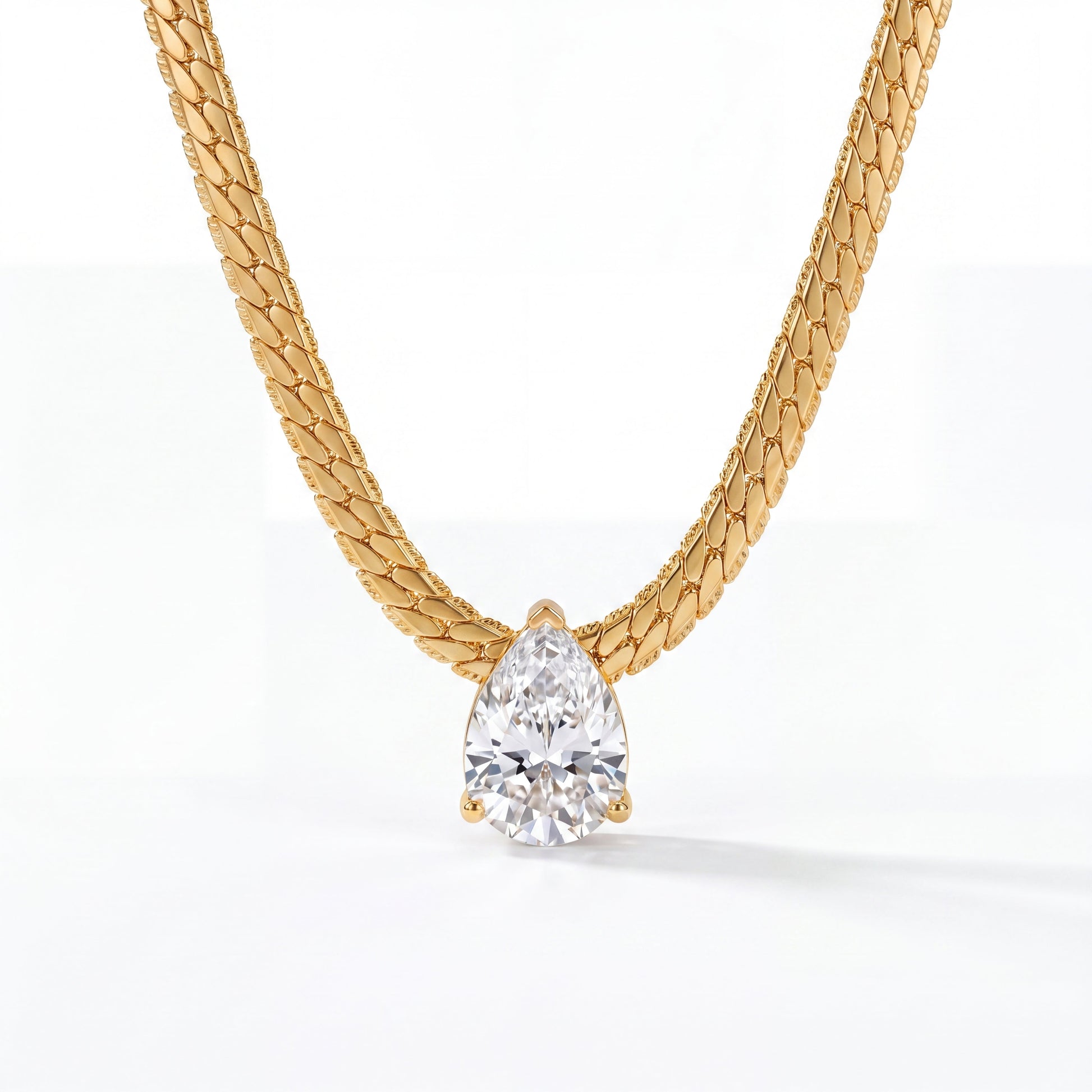 Goutte Necklace by VELTRĀ, 18K gold-plated necklace with pear-cut crystal pendant